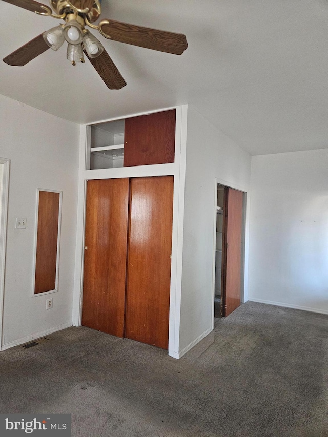 unfurnished bedroom with carpet, visible vents, ceiling fan, and baseboards