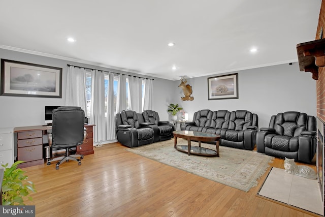 living room featuring ornamental molding, recessed lighting, and wood finished floors