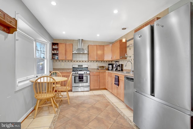 kitchen with stainless steel appliances, light tile patterned floors, wall chimney range hood, and tasteful backsplash