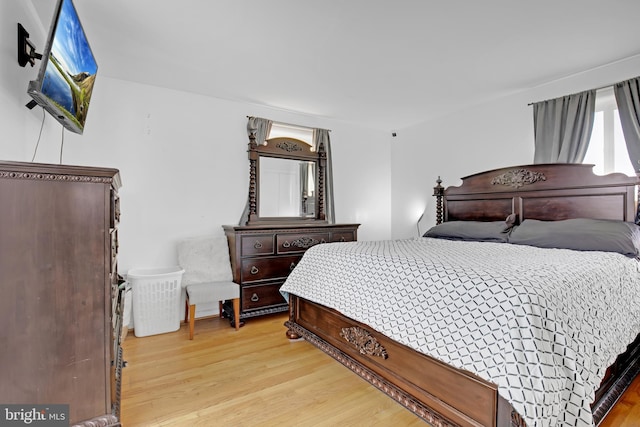 bedroom featuring light wood-style flooring