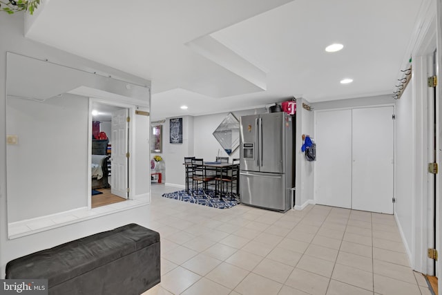 workout room with light tile patterned floors, baseboards, and recessed lighting