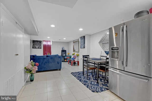 tiled dining area with recessed lighting and visible vents