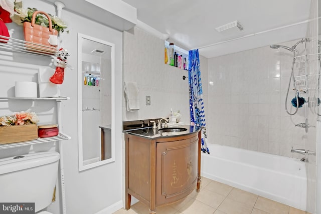 bathroom with toilet, vanity, visible vents, tile patterned floors, and shower / bath combo with shower curtain