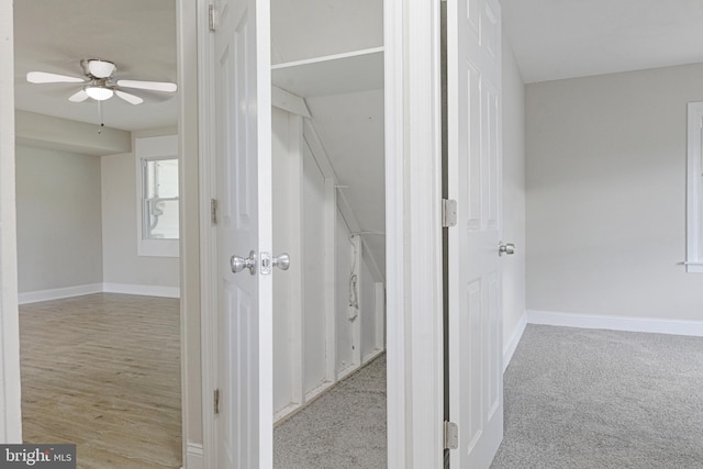 interior space with carpet flooring and baseboards