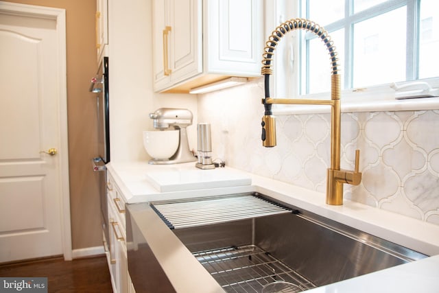 room details with light countertops and a sink