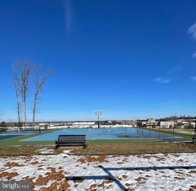 surrounding community featuring community basketball court and fence