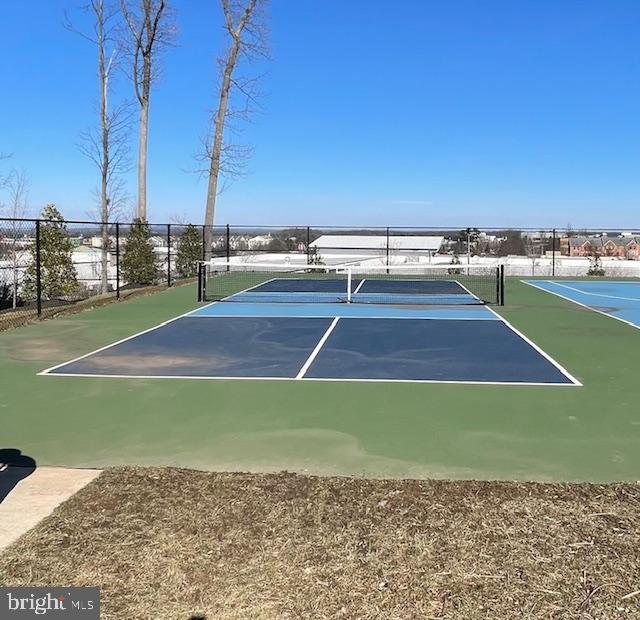 view of sport court with fence