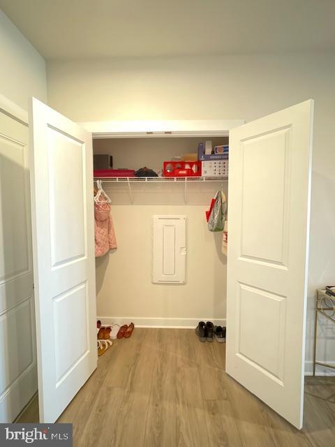 mudroom with wood finished floors