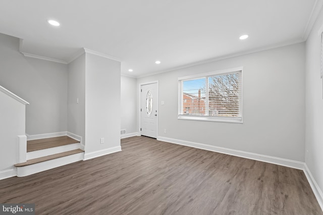 interior space with baseboards, stairway, wood finished floors, crown molding, and recessed lighting