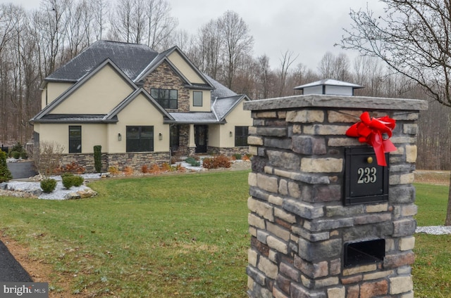 view of front of property with stone siding, a front lawn, and stucco siding