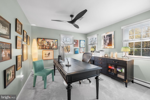 office area featuring a baseboard radiator, light carpet, plenty of natural light, and ceiling fan