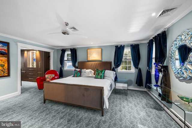 bedroom featuring a baseboard heating unit, visible vents, crown molding, and baseboards