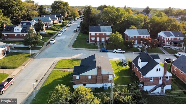 birds eye view of property with a residential view