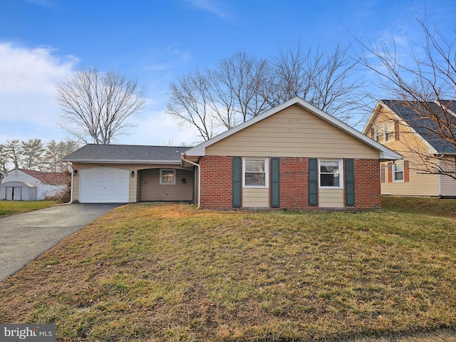 single story home featuring a garage, driveway, brick siding, and a front lawn