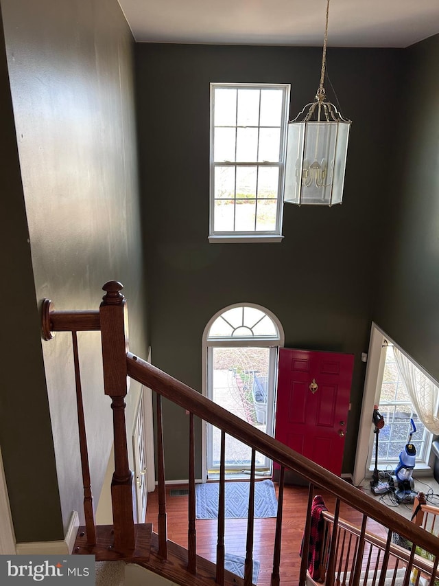 staircase featuring wood finished floors