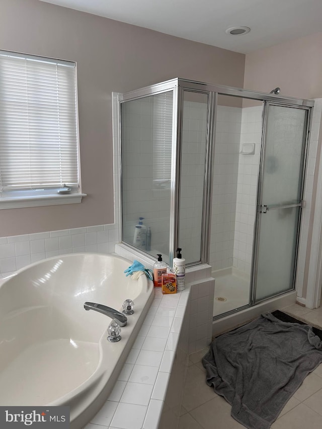 full bath with a shower stall, a garden tub, and tile patterned floors