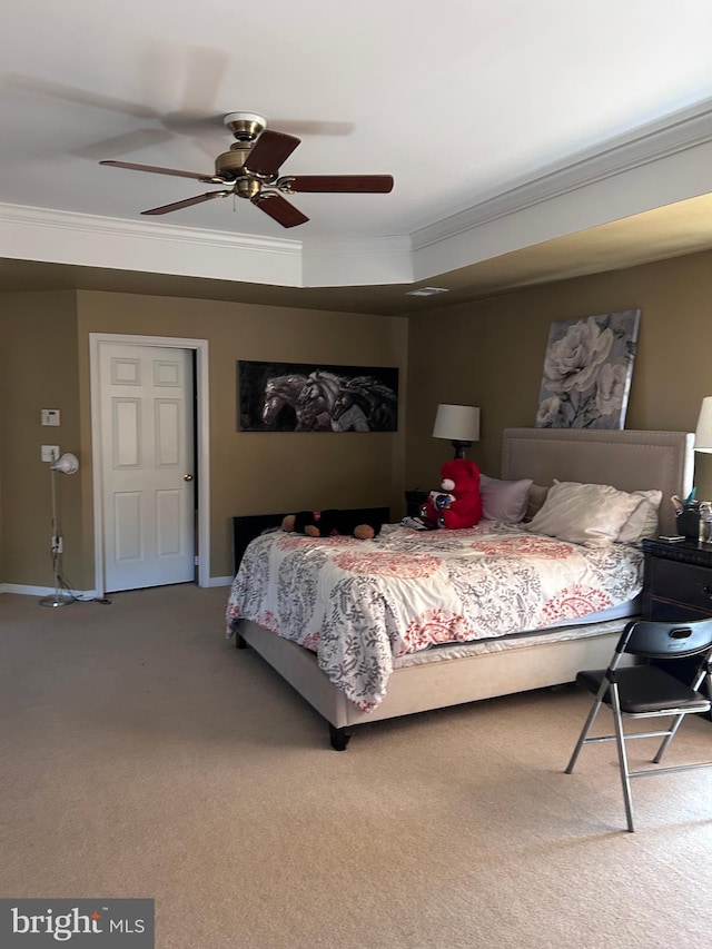 carpeted bedroom with baseboards, ceiling fan, and crown molding