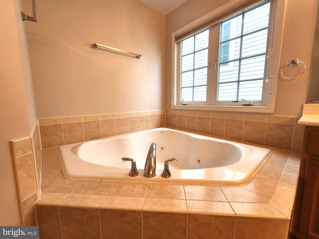 bathroom featuring a jetted tub and vanity