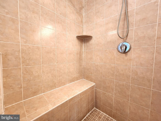 bathroom with a tile shower