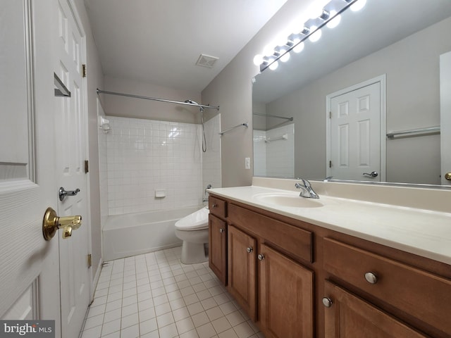 full bathroom featuring visible vents, toilet, washtub / shower combination, vanity, and tile patterned floors