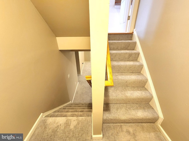 stairway with carpet and baseboards