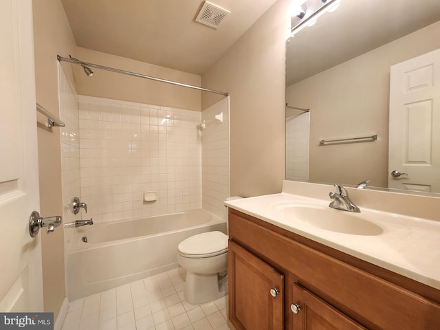 bathroom featuring toilet, vanity, visible vents, tub / shower combination, and tile patterned floors