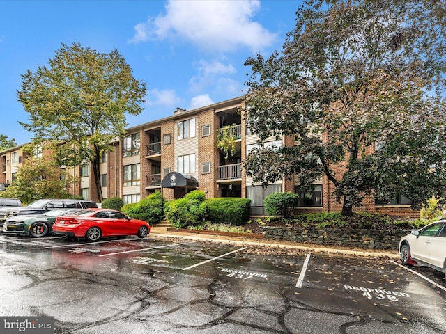 view of property with uncovered parking