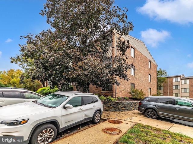 view of home's exterior with brick siding