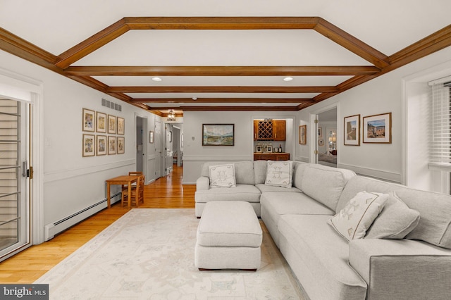 living room with a baseboard radiator, visible vents, beamed ceiling, and light wood-style flooring