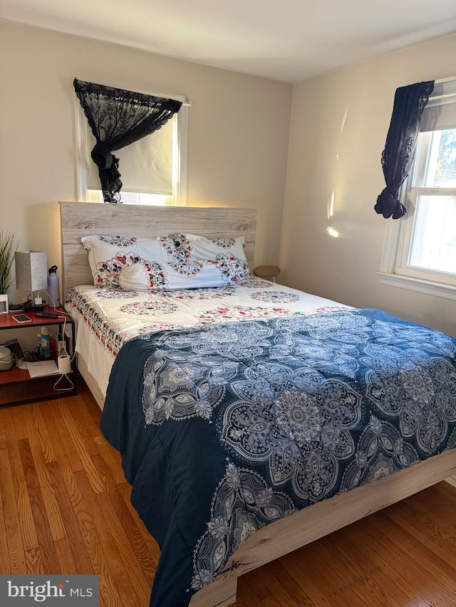 bedroom featuring wood finished floors