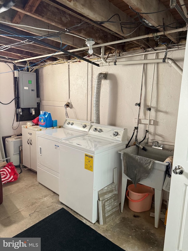 laundry room featuring washer and dryer, laundry area, and electric panel