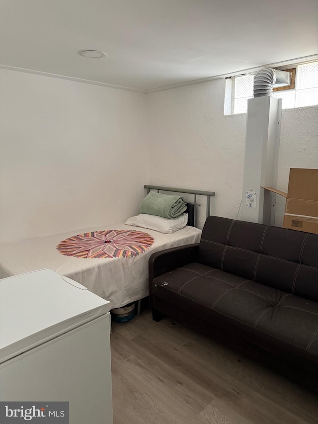 bedroom with wood finished floors