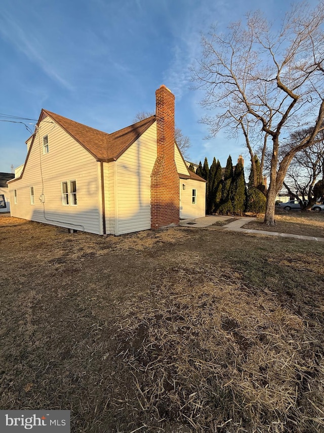 view of home's exterior featuring a chimney