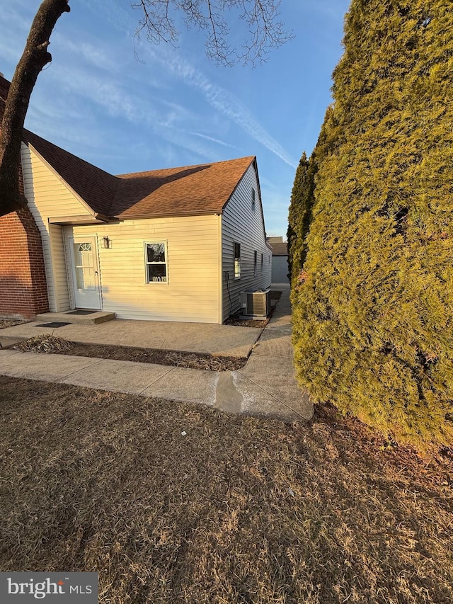 view of property exterior with cooling unit