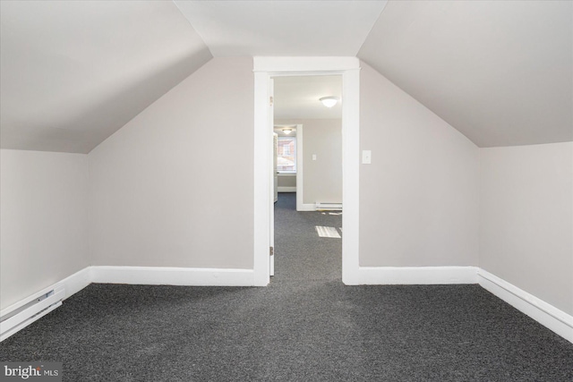 bonus room with carpet floors, vaulted ceiling, and baseboards