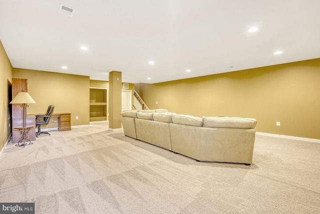 living room featuring light carpet, stairs, baseboards, and recessed lighting