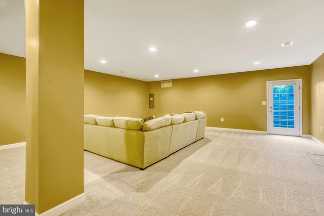 unfurnished living room featuring carpet floors, recessed lighting, visible vents, and baseboards