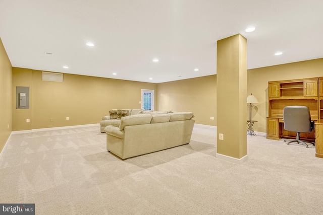 living area featuring recessed lighting, electric panel, light carpet, and baseboards