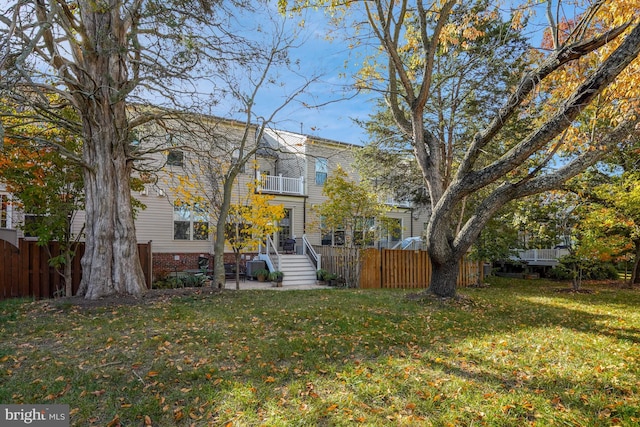 exterior space with fence private yard and a balcony