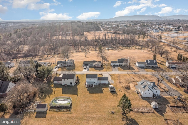 birds eye view of property with a mountain view