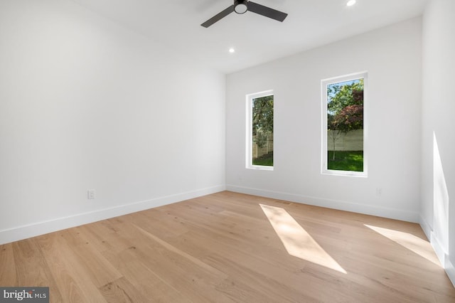 unfurnished room with light wood-style flooring, baseboards, ceiling fan, and recessed lighting