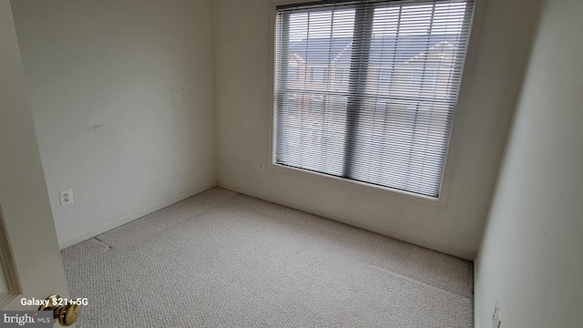 empty room featuring carpet floors