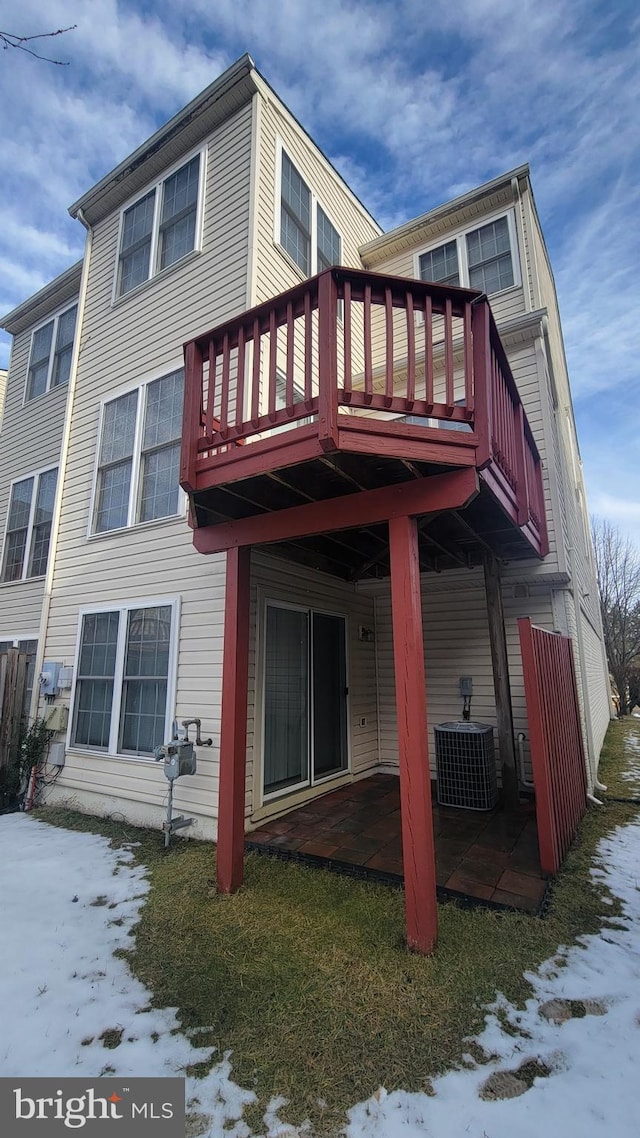 back of house with a patio area and central AC