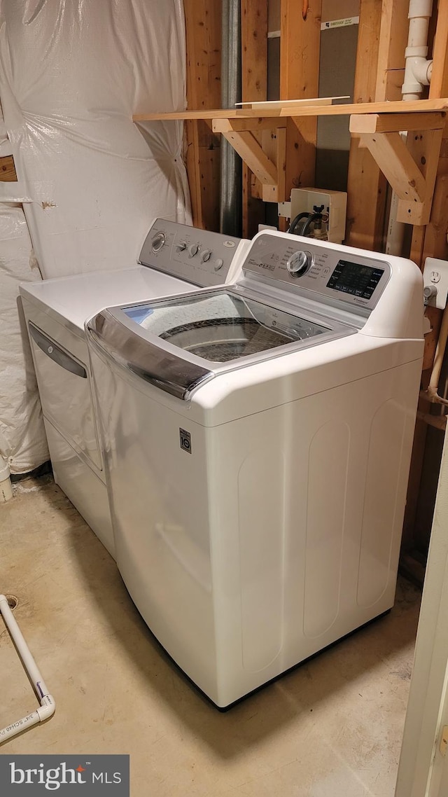 washroom with laundry area and separate washer and dryer