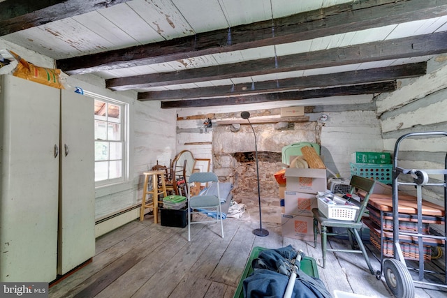 misc room featuring wooden ceiling, a baseboard heating unit, hardwood / wood-style floors, and beamed ceiling