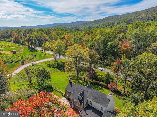 birds eye view of property with a wooded view