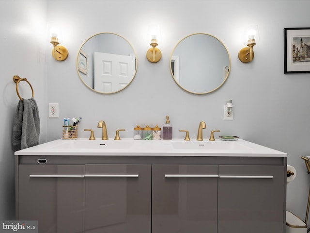 bathroom with a sink and double vanity