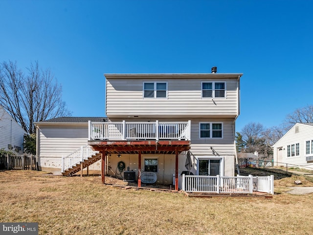 rear view of house featuring stairs, central air condition unit, a lawn, and a wooden deck