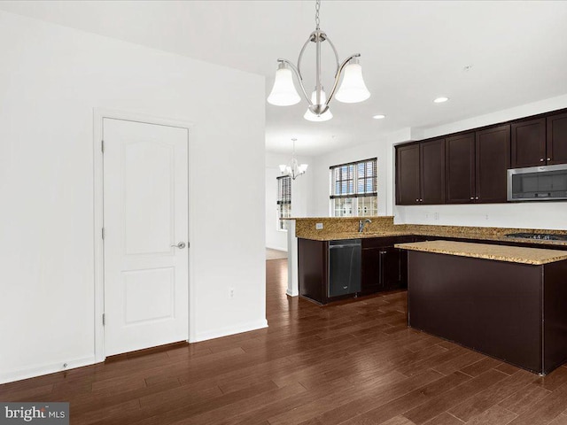 kitchen with stainless steel appliances, hanging light fixtures, an inviting chandelier, dark wood-type flooring, and dark brown cabinetry