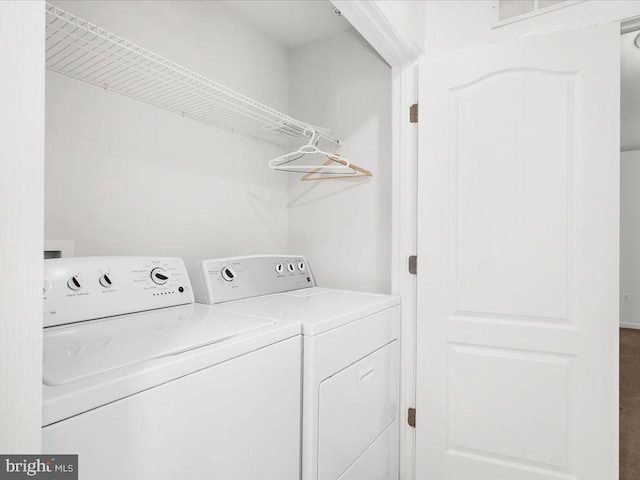 laundry area with laundry area and separate washer and dryer